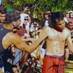 Jorge Masvidal conseille un combattant de muay thaï lors d'un combat de rue