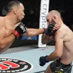 Damir Ismagulov et Guram Kutateladze dans la cage de l'UFC